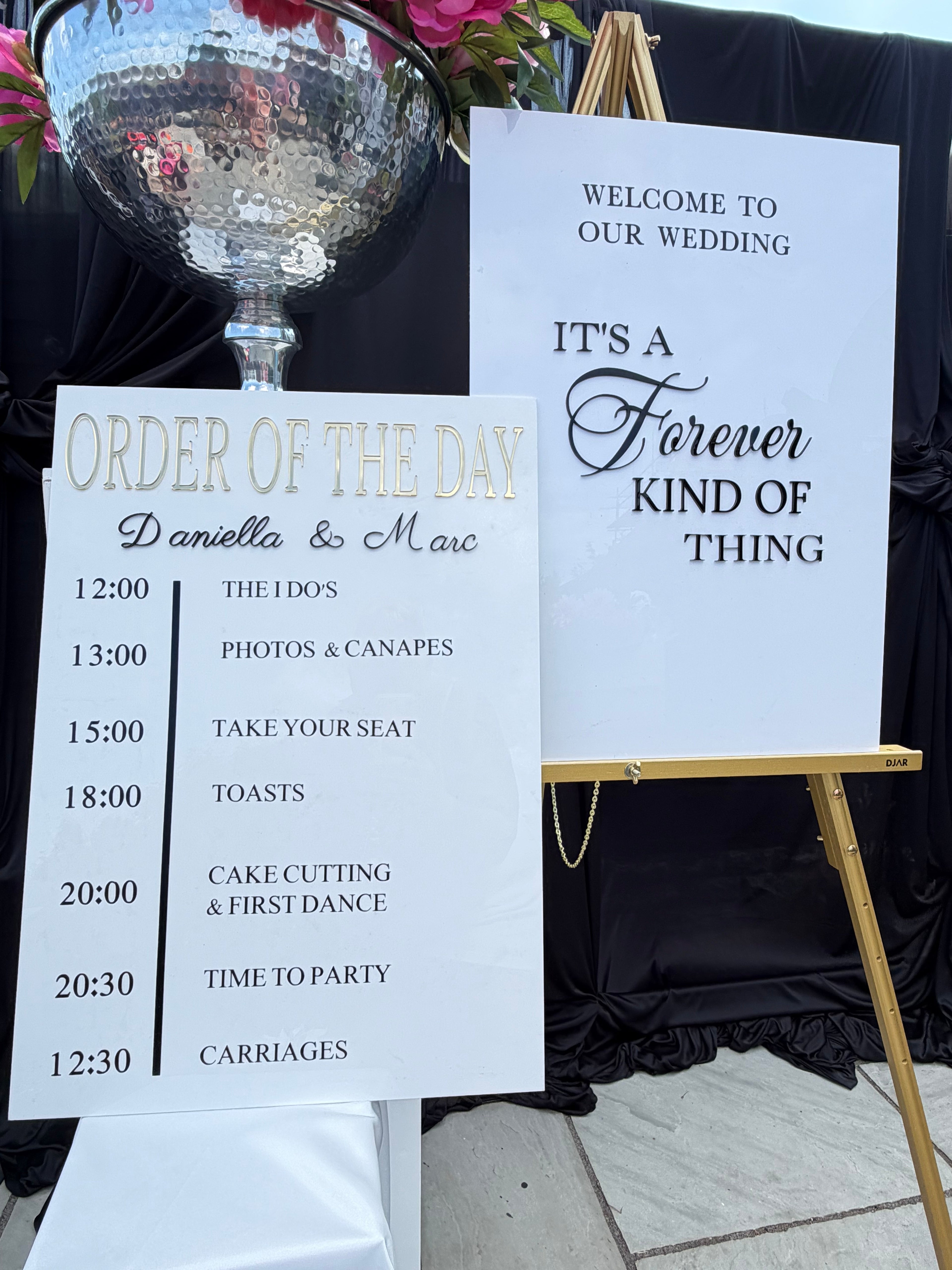Acrylic welcome sign and order of the day sign styled together