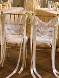 Handmade lace chair covers styled on wedding chairs